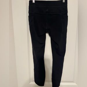 Athleta salutation pocket tights with perforated sides up to mid thigh